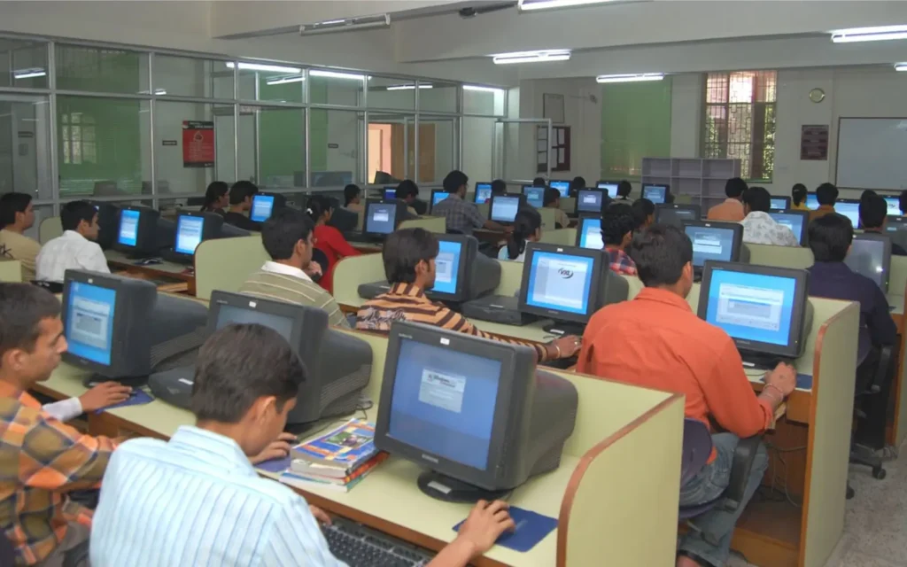 Healthcare professional comparing official requirements on a laptop