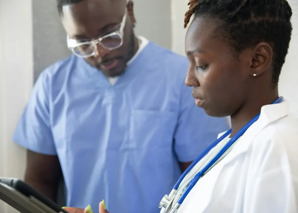 Nurse reviewing English test options and handwritten notes