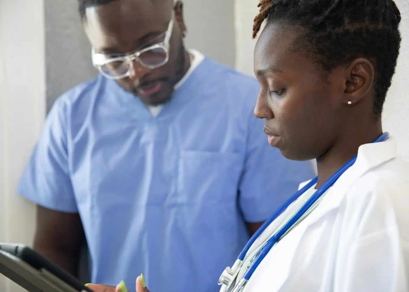 Nurse reviewing English test options and handwritten notes