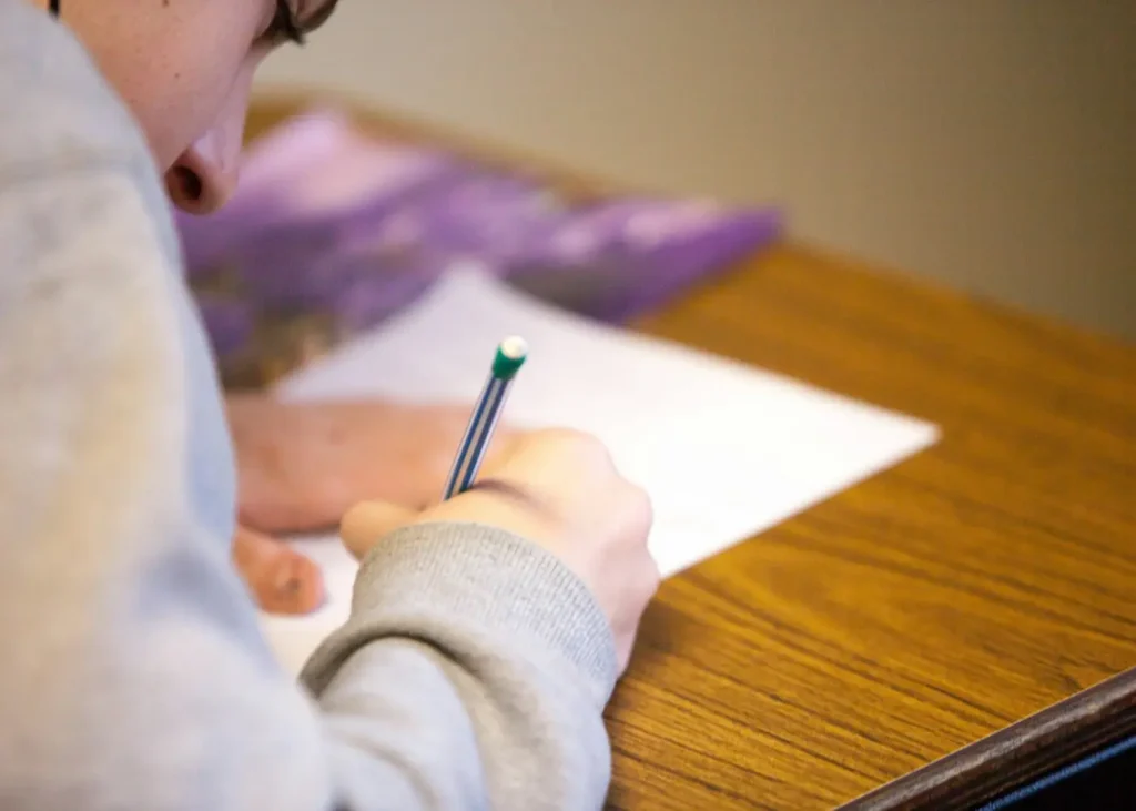 Learner using a pencil while studying